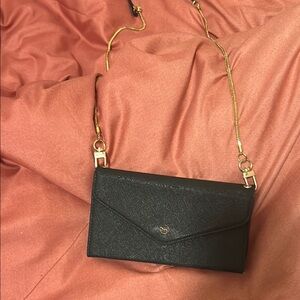 Elegant Black Crossbody Bag that’s is a cell phone case